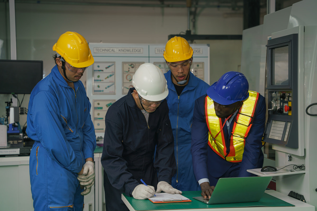 Group of workers reviewing technical training resources