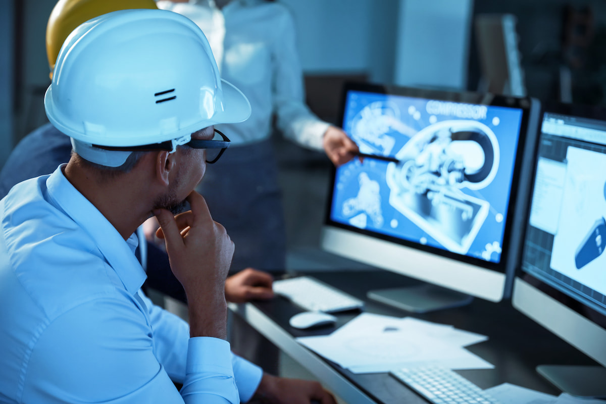 Team reviewing building plans on a computer screen